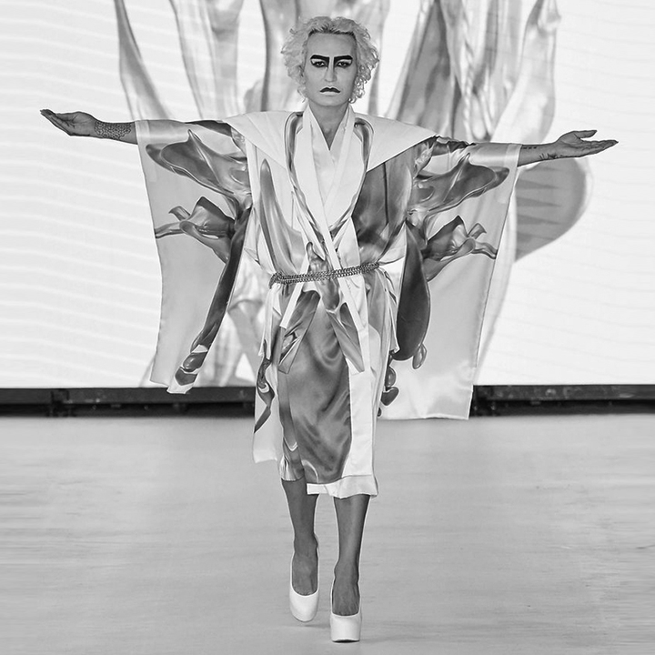 Elton Ilirjani walks the runway of the Global Fashion Collective